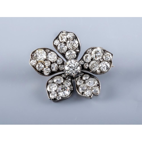 426 - A LATE VICTORIAN DIAMOND FLOWERHEAD BROOCH, centred by an old cut stone of approximately 0.55cts cla... 