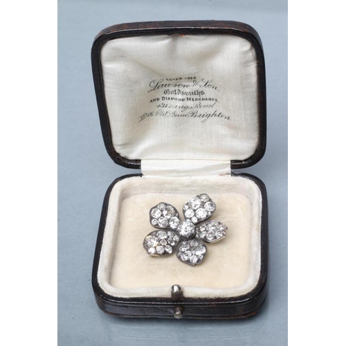 426 - A LATE VICTORIAN DIAMOND FLOWERHEAD BROOCH, centred by an old cut stone of approximately 0.55cts cla... 