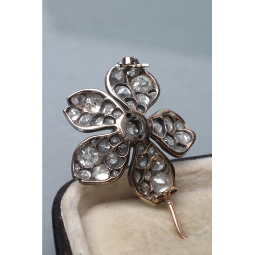 426 - A LATE VICTORIAN DIAMOND FLOWERHEAD BROOCH, centred by an old cut stone of approximately 0.55cts cla... 