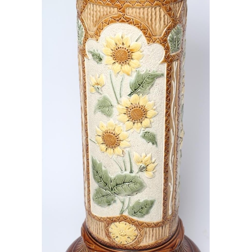 43 - A BURMANTOFTS FAIENCE JARDINIERE STAND, early 20th century, of cylindrical form moulded and painted ... 