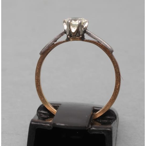 437 - A SOLITAIRE DIAMOND RING, the round brilliant of approximately 0.25cts, claw set to white shoulders ... 