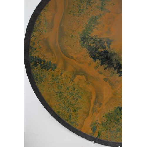 45 - ANDREW HILL (b.1964), A studio pottery shallow circular charger with a green and amber swirl glaze, ... 