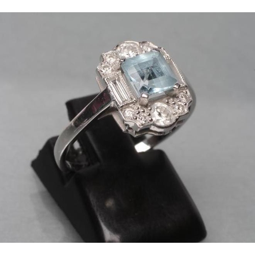 462 - AN ART DECO DRESS RING, the square cut aquamarine claw set to baguette diamond set shoulders and ten... 