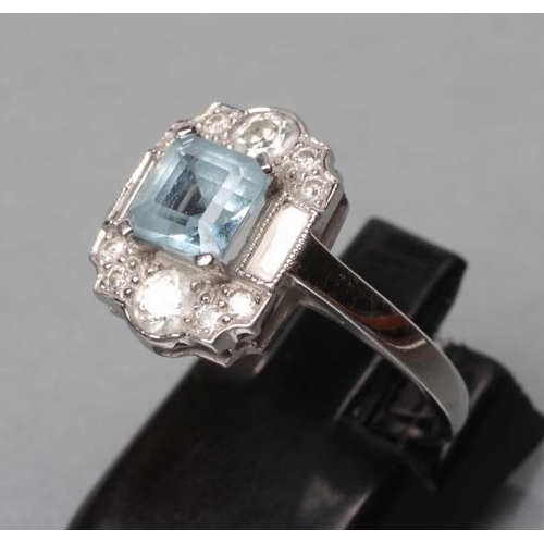 462 - AN ART DECO DRESS RING, the square cut aquamarine claw set to baguette diamond set shoulders and ten... 