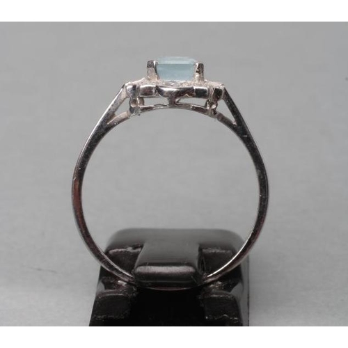 462 - AN ART DECO DRESS RING, the square cut aquamarine claw set to baguette diamond set shoulders and ten... 