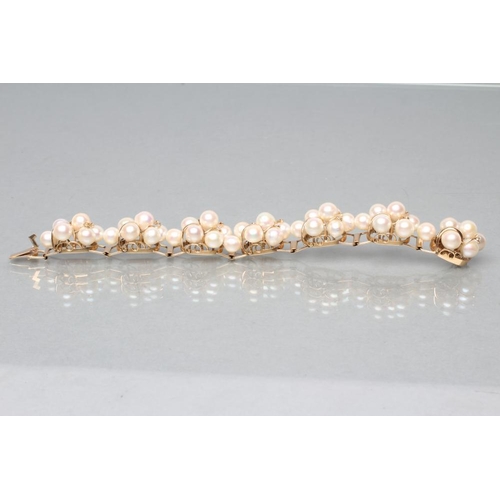 464 - A MODERN CULTURED PEARL BRACELET, the seven abstract set panels of seven pearls wired to a plain fra... 