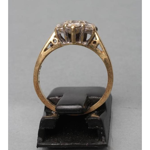 477 - A DIAMOND CLUSTER RING, the seven old cut stones point set to a plain shank stamped 18k, size I 1/2 ... 