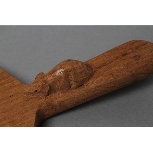 521 - A ROBERT THOMPSON ADZED OAK CHEESE BOARD of oval form, carved mouse trademark in high relief to lug ... 