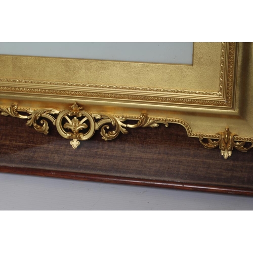 539 - A VICTORIAN GILT GESSO PICTURE FRAME of earred oblong form with pierced scroll surmount hanging flor... 