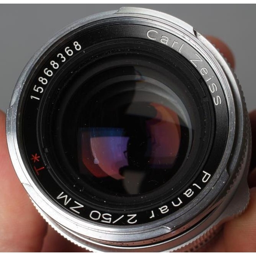 545 - A CARL ZEISS PLANAR LENS, 2/50 ZM, T*, 15868368, boxed, together with an Ernst Leitz GmbH Wetzlar le... 