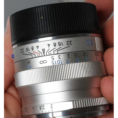 545 - A CARL ZEISS PLANAR LENS, 2/50 ZM, T*, 15868368, boxed, together with an Ernst Leitz GmbH Wetzlar le... 