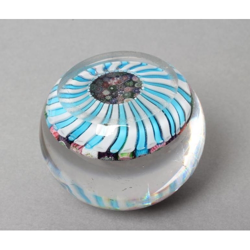 55 - A CLICHY GLASS PAPERWEIGHT, the close millefiori coloured canes over a turquoise and striped cane ba... 