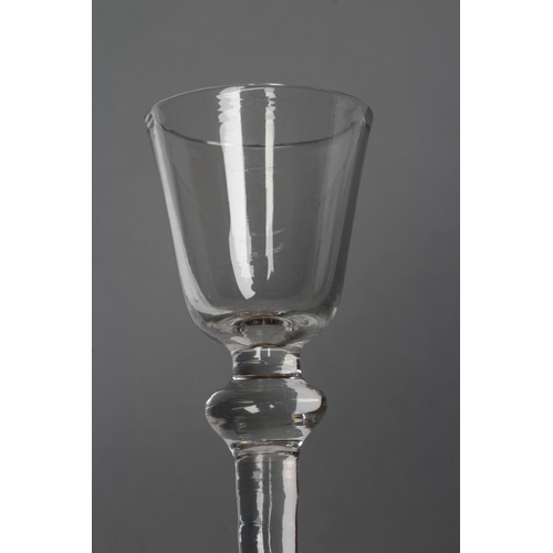 64 - A CORDIAL GLASS, mid 18th century, the round funnel bowl on a plain knopped stem and folded domed fo... 