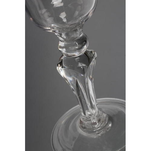 65 - A CORDIAL GLASS, mid 18th century, the ogee bowl on a knopped square section tapering stem and folde... 