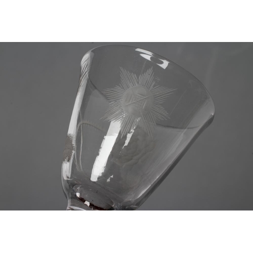 69 - A JACOBITE WINE GLASS, mid 18th century, the round funnel bowl engraved with a rose and bud and a st... 