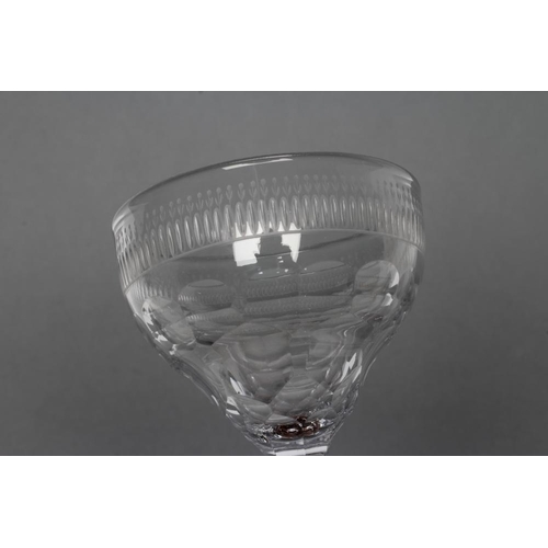 71 - A SWEETMEAT GLASS, late 18th century, the panel cut wide ogee bowl on central knopped faceted stem a... 