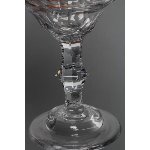 71 - A SWEETMEAT GLASS, late 18th century, the panel cut wide ogee bowl on central knopped faceted stem a... 