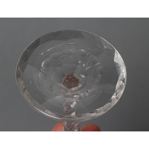 73 - A WINE GLASS, late 18th century, the round funnel bowl with pendant husk and foliate engraved rim, t... 