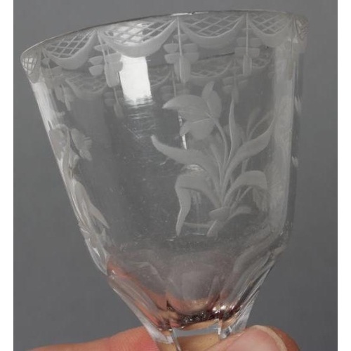 74 - A WINE GLASS, mid 18th century, the round funnel bowl wheel engraved with three sprays of flowers be... 