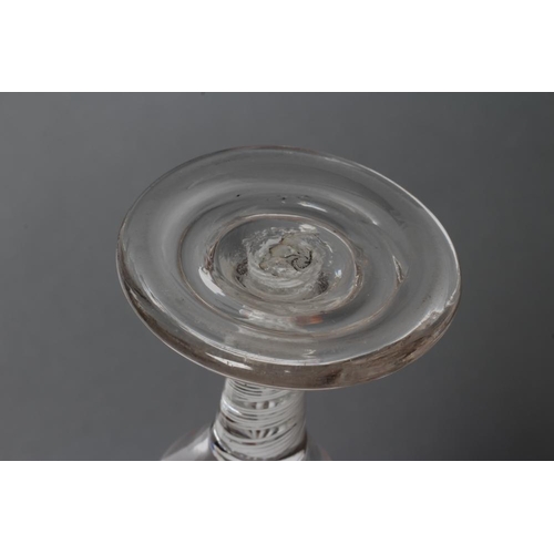 75 - A FIRING GLASS, mid 18th century, the plain ogee bowl on an opaque twist stem with central gauze sur... 