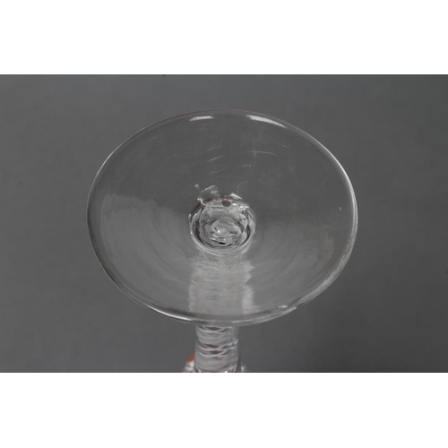 76 - A WINE GLASS, mid 18th century, the semi-wrythen mould blown round funnel bowl on an opaque twist st... 