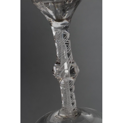 77 - A CORDIAL GLASS, mid 18th century, the vertical mould blown ogee bowl with wheel engraved flowerhead... 