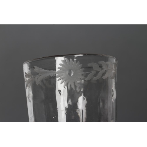 77 - A CORDIAL GLASS, mid 18th century, the vertical mould blown ogee bowl with wheel engraved flowerhead... 