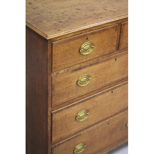 774 - AN OAK AND MAHOGANY BANDED CHEST, early 19th century, the moulded edged top over two short and three... 