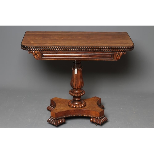 776 - A GEORGE IV ROSEWOOD FOLDING TEA TABLE, the rounded oblong swivel top with beaded edging, panelled f... 