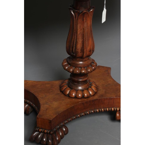 776 - A GEORGE IV ROSEWOOD FOLDING TEA TABLE, the rounded oblong swivel top with beaded edging, panelled f... 