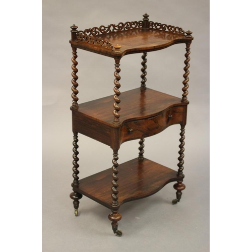 779 - A VICTORIAN ROSEWOOD THREE TIER WHATNOT of oblong serpentine form with pierced gallery, spiral suppo... 