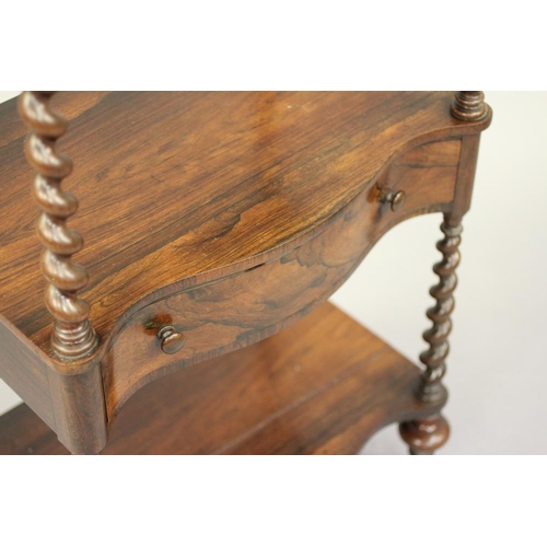 779 - A VICTORIAN ROSEWOOD THREE TIER WHATNOT of oblong serpentine form with pierced gallery, spiral suppo... 