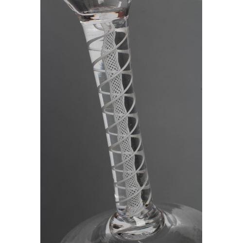 78 - A CORDIAL GLASS, mid 18th century, the ogee bowl wheel engraved with vines on an opaque twist stem w... 