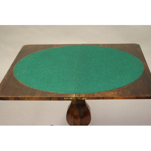 780 - AN EARLY VICTORIAN ROSEWOOD CARD TABLE, the banded rounded oblong top opening to a circular green ba... 