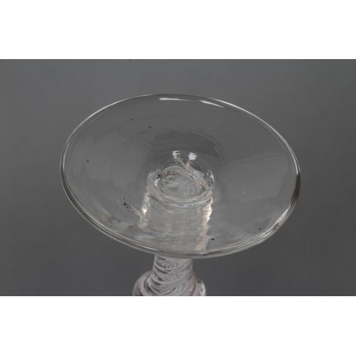 81 - A COMPOSITE WINE GLASS, mid 18th century, the round funnel bowl on annulated knop over a further pla... 