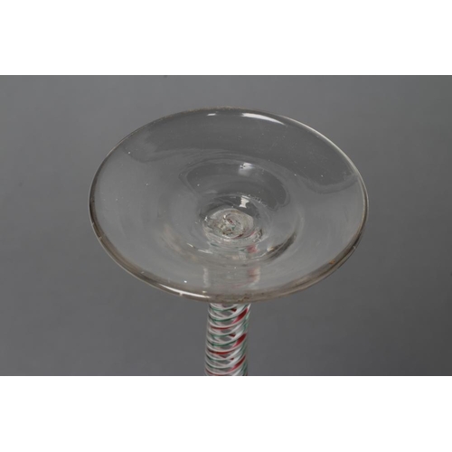 87 - A CORDIAL GLASS, mid 18th century, the ogee bowl on multi-ply opaque twist stem with a red and green... 