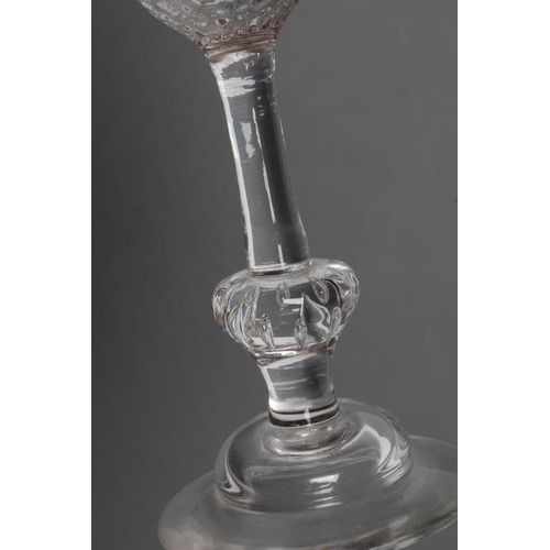 91 - A WINE GLASS, mid 18th century, the honeycomb mould blown round funnel bowl on plain stem, with basa... 