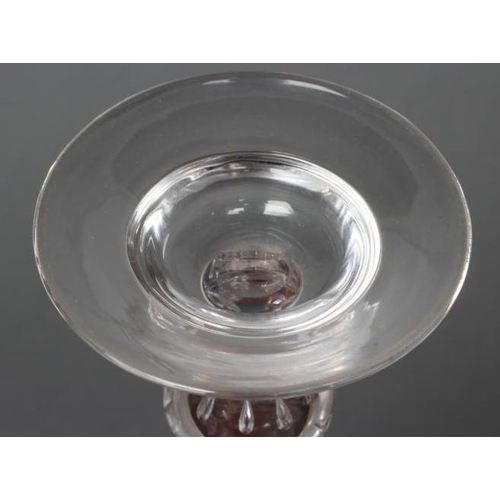 91 - A WINE GLASS, mid 18th century, the honeycomb mould blown round funnel bowl on plain stem, with basa... 