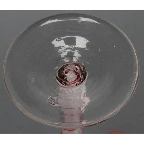 94 - A WINE GLASS, mid 18th century, the bell bowl on an opaque twist stem with a multi-ply spiral surrou... 