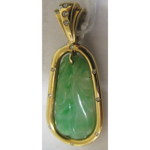 381 - A JADE PENDANT, the tear shaped panel carved with stylised fruit pierced to hang from a cylindrical ... 