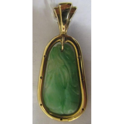 381 - A JADE PENDANT, the tear shaped panel carved with stylised fruit pierced to hang from a cylindrical ... 