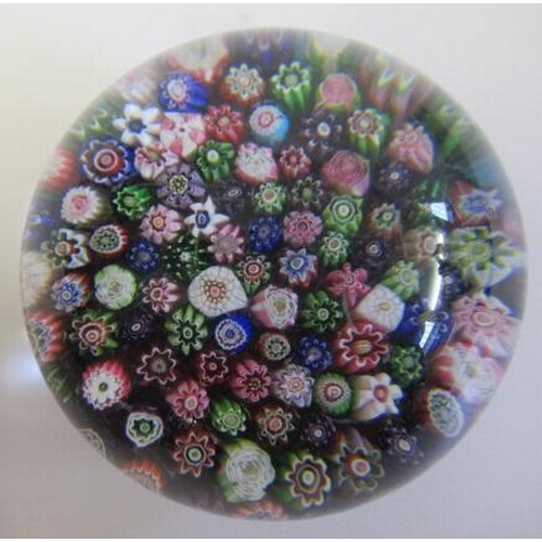 55 - A CLICHY GLASS PAPERWEIGHT, the close millefiori coloured canes over a turquoise and striped cane ba... 