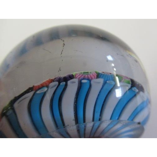 55 - A CLICHY GLASS PAPERWEIGHT, the close millefiori coloured canes over a turquoise and striped cane ba... 