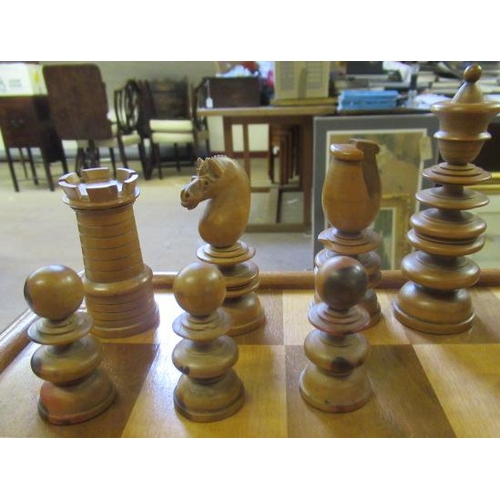 507 - A TURNED WOOD CHESS SET in box and hardwood, kings 3 3/4