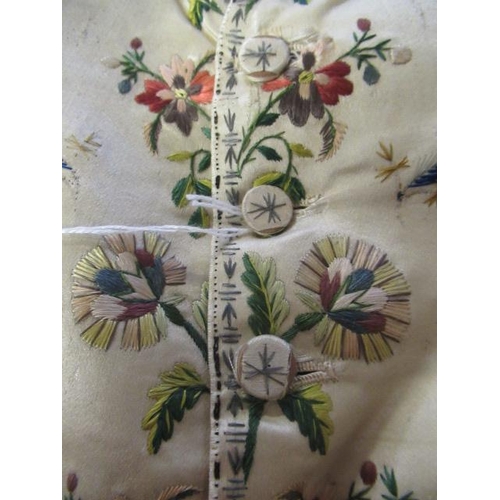 531 - A REGENCY GENTLEMAN'S CREAM SILK WAISTCOAT, c.1790, embroidered in coloured silks with flower heads ... 