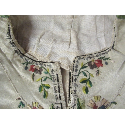 531 - A REGENCY GENTLEMAN'S CREAM SILK WAISTCOAT, c.1790, embroidered in coloured silks with flower heads ... 