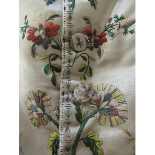 531 - A REGENCY GENTLEMAN'S CREAM SILK WAISTCOAT, c.1790, embroidered in coloured silks with flower heads ... 