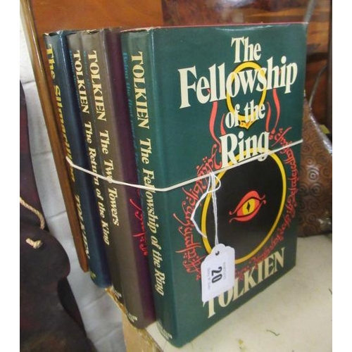 20 - FOUR TOLKIEN HARDBACK LORD OF THE RINGS TRILOGY AND THE SILAMRILLION