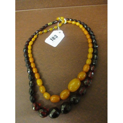 183 - TWO AMBER COLOURED BEAD NECKLACES