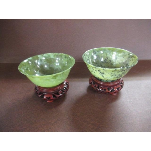 326 - TWO GREEN JADEITE BOWLS ON STANDS